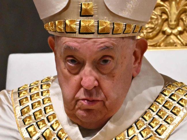 (FILES) Pope Francis leads a mass during the first Vespers and the Te Deum prayer as part of the New Year's celebrations in Saint Peter's Basilica, at the Vatican, on December 31, 2024. Pope Francis, in hospital with pneumonia, suffered a breathing "crisis" which caused him to vomit, but he was given air and responded well, the Vatican said on February 28, 2025. (Photo by Andreas SOLARO / AFP)