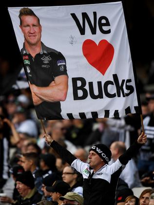 A Collingwood fan supports Nathan Buckley.