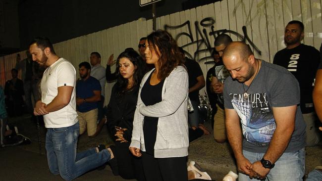 Protesters conduct a religious ceremony to oppose the Scott Marsh mural that has since been painted over in Newtown. (Pic: Danny Casey/AAP)