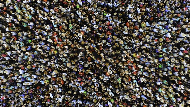 Big crowd of people, population generic. People gathered together in one place. Top view from drone. Picture: iStock