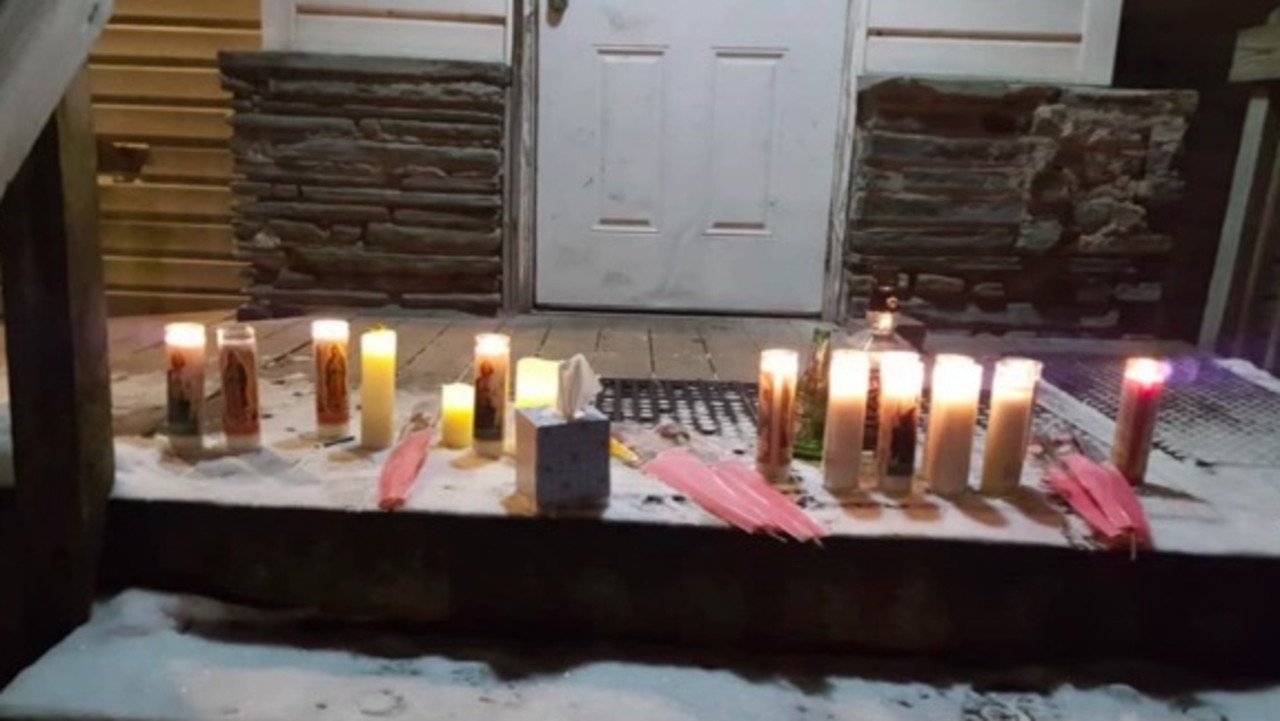 Lit candles were left on a doorstep in memory of Christopher Pekny. Picture: Facebook.