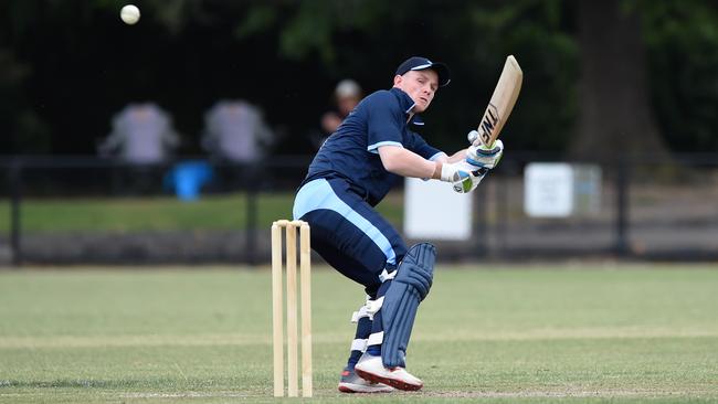 Andrew Chalkley plays a reverse sweep for a boundary.