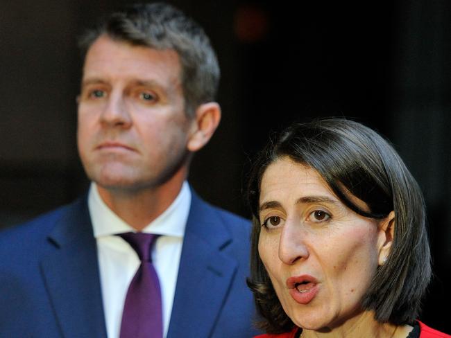 **FILE** A Friday, Aug. 19, 2016 file photo of NSW Premier Mike Baird (L) and NSW Treasurer Gladys Berejiklian speak to the media in Sydney. Baird announced on Thursday that it was time to hand over the reins to a new premier for the state. (AAP Image/Joel Carrett) NO ARCHIVING