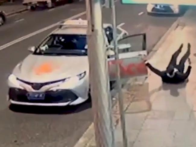 *FILE PIX* NCA NewsWire Photos: CCTV footage allegedly shows Mirvac executive Brett Henson falling over on to his back after having an altercation with a Sydney taxi driver. Picture: NCA NewsWire handout