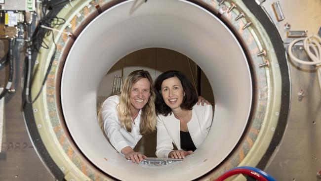 Austin Health clinicians Kym Rykers and Penny Sanderson with the partially installed machine. Picture: Ellen Smith