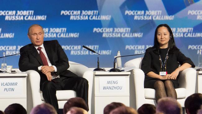 Meng Wanzhou (right) joins Russian president Vladimir Putin during a session of the VTB Capital Investment Forum “Russia Calling!” in Moscow in October, 2014. Picture: Reuters