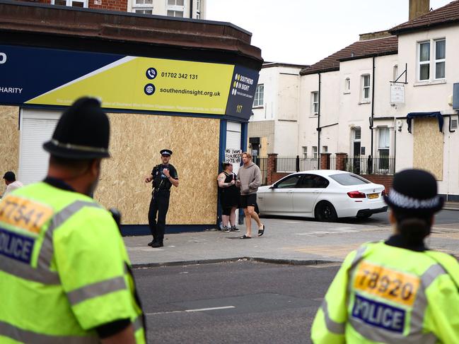 Police officers patrol ahead of an anti-immigration protest called by far-right activists in Westcliff near Southend-on-Sea. Picture: AFP