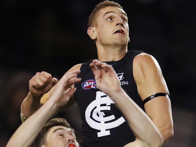 AFL Round 12. Carlton vs. GWS Giants at Etihad Stadium. Carlton's Liam Jones climbs over GWS Giants Jeremy Cameron to spoil   . Pic: Michael Klein