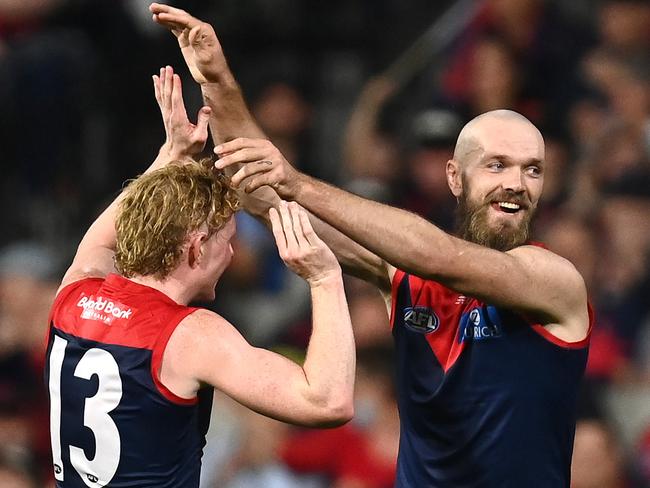 MELBOURNE, AUSTRALIA - APRIL 16: Max Gawn of the Demons is congratulated by Clayton Oliver after kicking a goal during the round five AFL match between the Melbourne Demons and the Greater Western Sydney Giants at Melbourne Cricket Ground on April 16, 2022 in Melbourne, Australia. (Photo by Quinn Rooney/Getty Images)