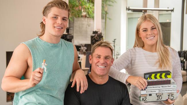 Jackson and Brooke Warne with dad Shane filming an ad for the upcoming cricket World Cup for KAYO. Picture: Jason Edwards