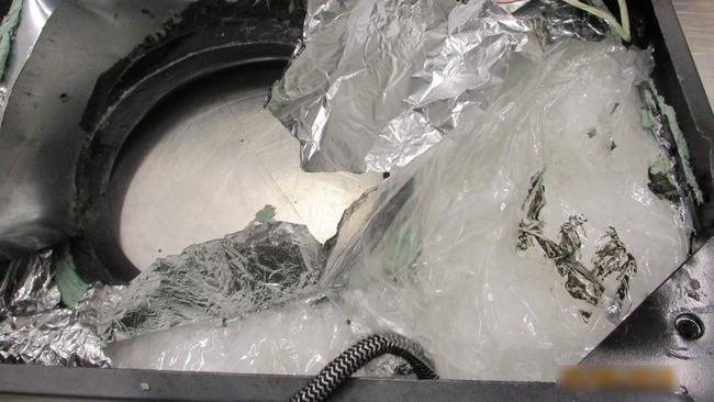 An AFP spokesman said the cookers were found with “five packages containing a white crystalline substance.”