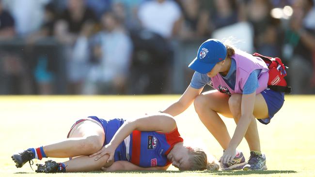 MELBOURNE, AUSTRALIA - FEBRUARY 4: Daria Bannister of the Bulldogs is seen injured during the 2018 AFLW Round 01 match between the Western Bulldogs and the Fremantle Dockers at VU Whitten Oval on February 4, 2018 in Melbourne, Australia. (Photo by Adam Trafford/AFL Media/Getty Images)