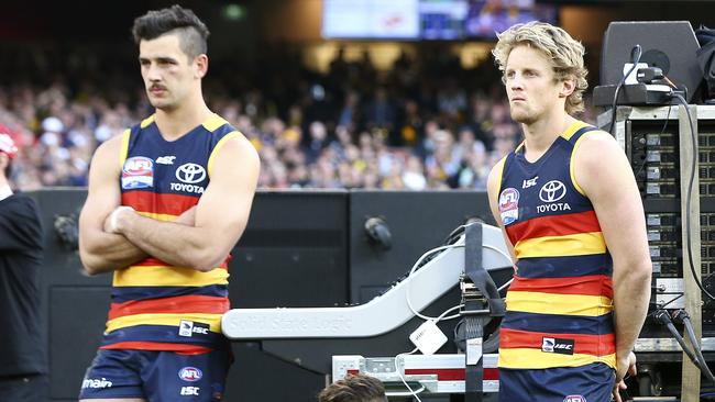 Taylor Walker and Rory Sloane watch post-match presentations. Picture: Sarah Reed