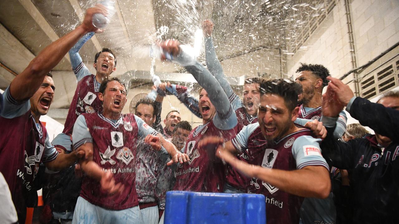 APIA players react in the dressing rooms following their win in the FFA Cup Round of 16