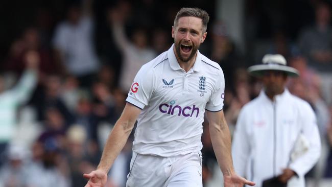 England's Chris Woakes celebrates after taking the wicket of Australia's Steven Smith on day five.