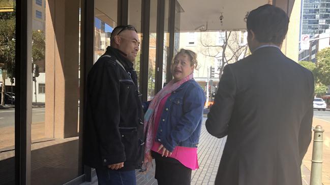 Samisoni Mafuadaimi (left) leaves Parramatta Local Court with a supporter and his lawyer (right).