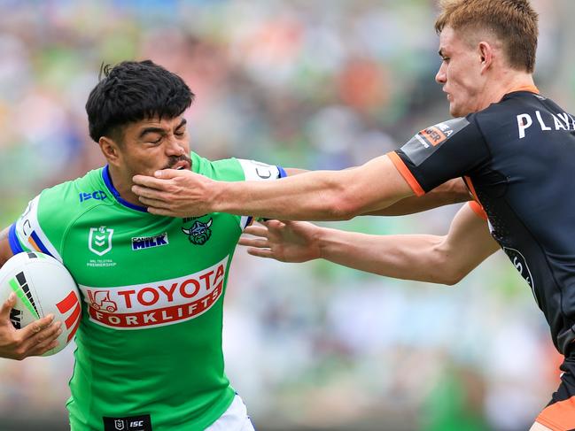 Matthew Timoko looks to evade a tackle from debutant Lachlan Galvin. Picture: Jenny Evans/Getty Images