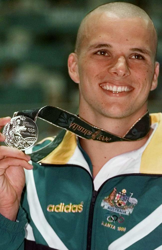 Scott Miller with his silver medal after the men's final of 100m butterfly at the 1996 Olympic Games in Atlanta. Picture: AP