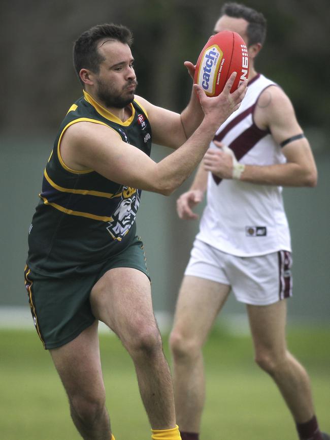 Pembroke's Tom Evans takes a strong mark against Colonel Light Gardens. Evans is the Kings’ leading goal kicker this season and has been for at least the past five years. Picture: AAP/Dean Martin