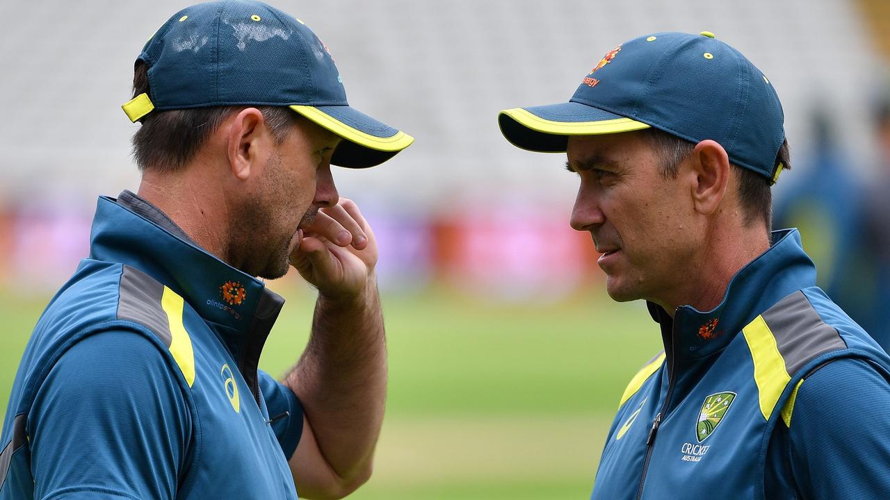 Ricky Ponting chats to former Australian coach Justin Langer.