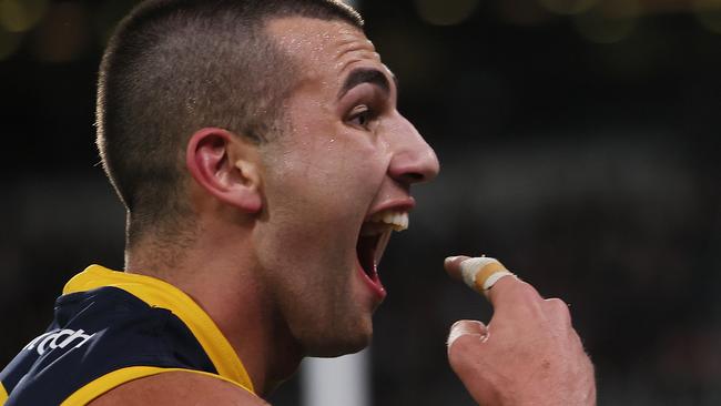 ADELAIDE, AUSTRALIA - AUG 17: Josh Rachele of the Crows gestures to the crowd after scoring a goal during the 2024 AFL Round 23 match between the port Adelaide Power and the Adelaide Crows at Adelaide Oval on August 17, 2024 in Adelaide, Australia. (Photo by James Elsby/AFL Photos via Getty Images)