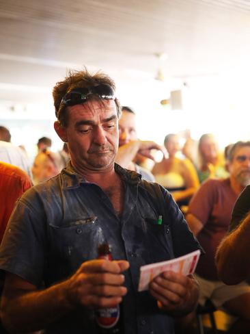 A punter at the Noonamah Tavern has a closer look at his card following the Melbourne Cup race on Tuesday. PICTURE: Justin Kennedy