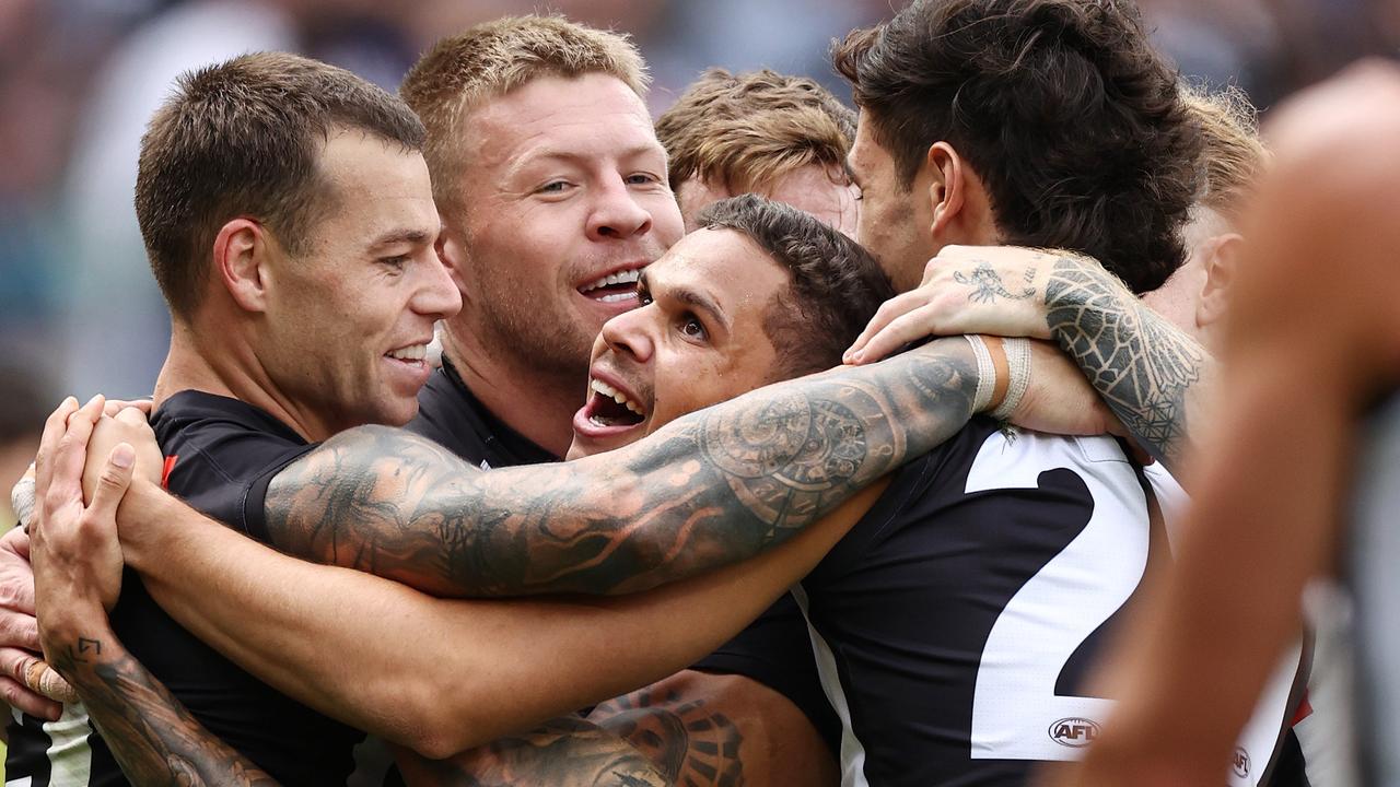 Bobby Hill and his Magpies teammates enjoy a great last quarter goal. Picture: Michael Klein