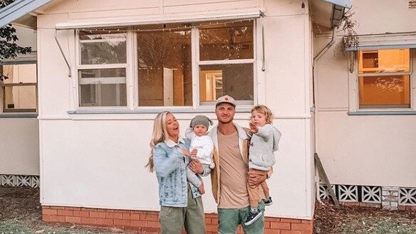 Kyal and Kara with their kids at their latest reno project in Bateau Bay. Source: Instagram @kyalandkara