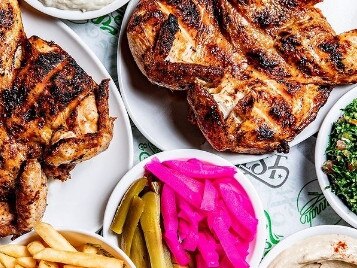El Jannah chicken with sides including hot chips and pickles. Picture: Instagram