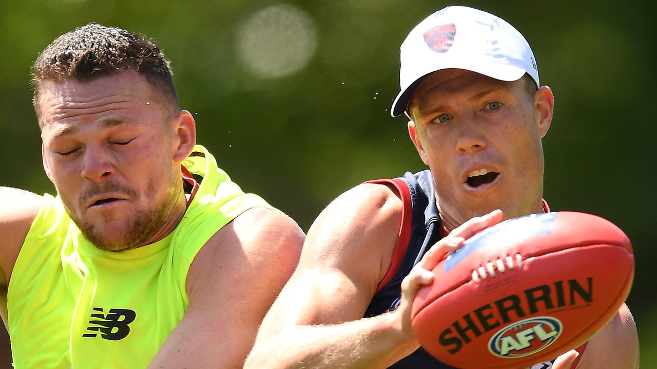 MELBOURNE, AUSTRALIA - NOVEMBER 18: Jake Melksham of the Demons marks infront of Steven May of the Demons during a Melbourne Demons Training Session &amp; Media Opportunity at Gosch's Paddock on November 18, 2019 in Melbourne, Australia. (Photo by Quinn Rooney/Getty Images via AFL Photos)