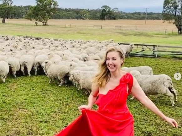 Catriona Rowntree dons a full length red gown  at her farm near Geelong. Picture: Instagram