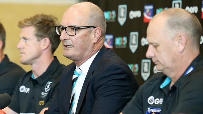 Port Adelaide chairman David Koch, flanked by coach Ken Hinkley (right) and new captain Tom Jonas (left) during the club’s 2020 leadership announcement. Picture: Kelly Barnes (AAP)