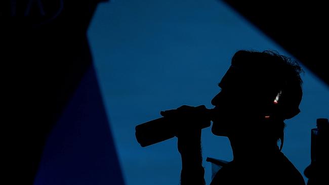 Roger Federer cools off during Australian Open practice yesterday. Picture: Getty