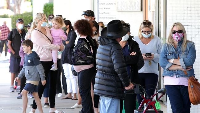 People queue for Covid-19 test at Sullivan Nicolaides Caloundra, after two Covid positive people Arrived in Queensland and crossed the border at Goondiwindi and went to the Sunshine Coast, on Thursday 10th June 2021, Photo Steve Pohlner