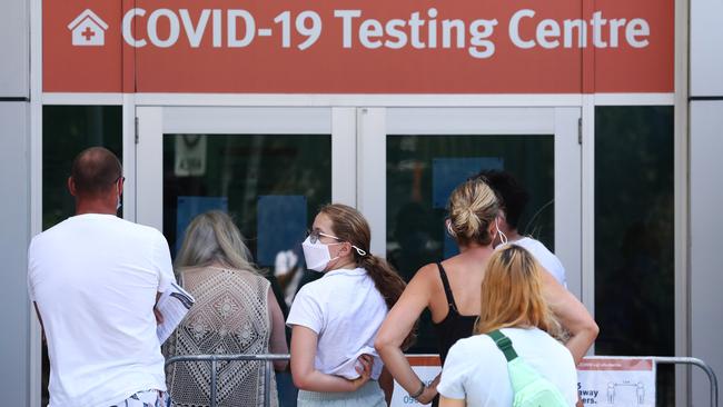 People line up to get tested for COVID-19 at The Gold Coast University Hospital. Picture: Jason O'Brien.