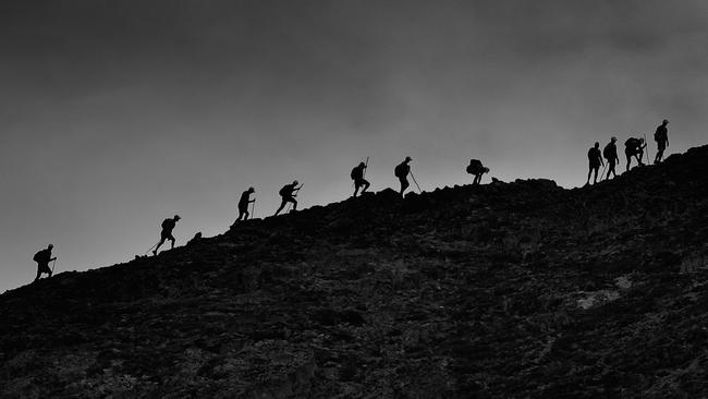 Players set off on their hike up Mount Peel at 7am. Picture: Michael Willson/AFL Media