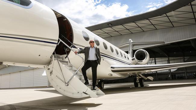 Paul Little with his private jet at the Jet Base in Tullamarine, Melbourne. Photo: Julian Kingma