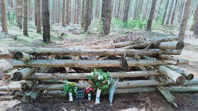 Flowers placed where Dr Yen-Yung Yap was found in Kuitpo forest, nearly two days after his wife Mei-Khing Loo reported him missing.