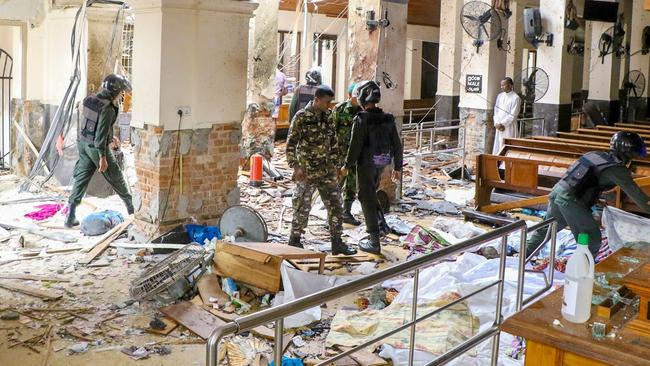 Security forces inspect the damage from the blast at St Anthony's Church in Kochchikade in Colombo yesterday. Picture: Getty Images