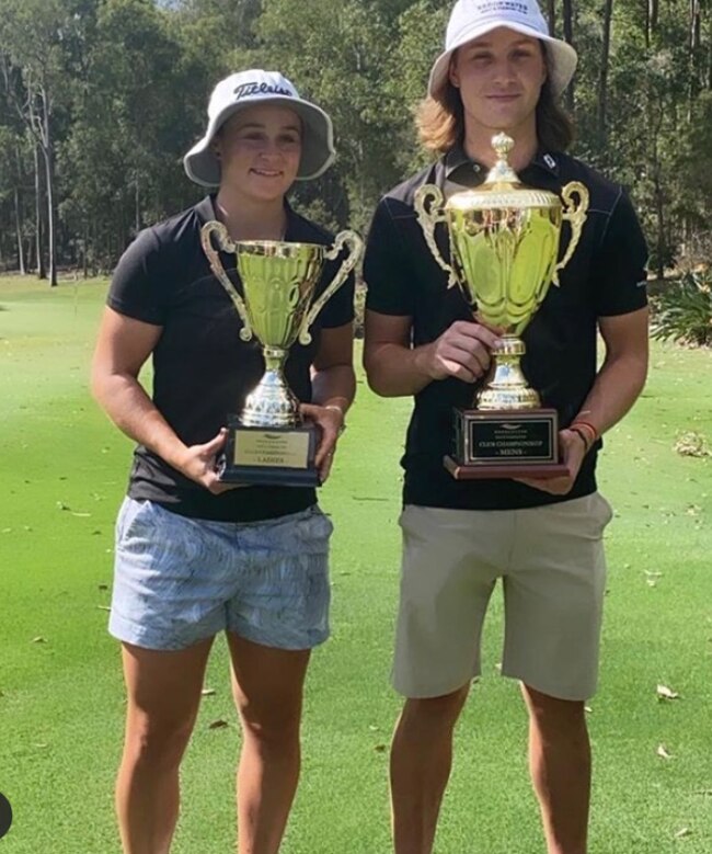 World tennis number one Ash Barty (left) with her trophy for winning the women's club championship at Brookwater Golf Club