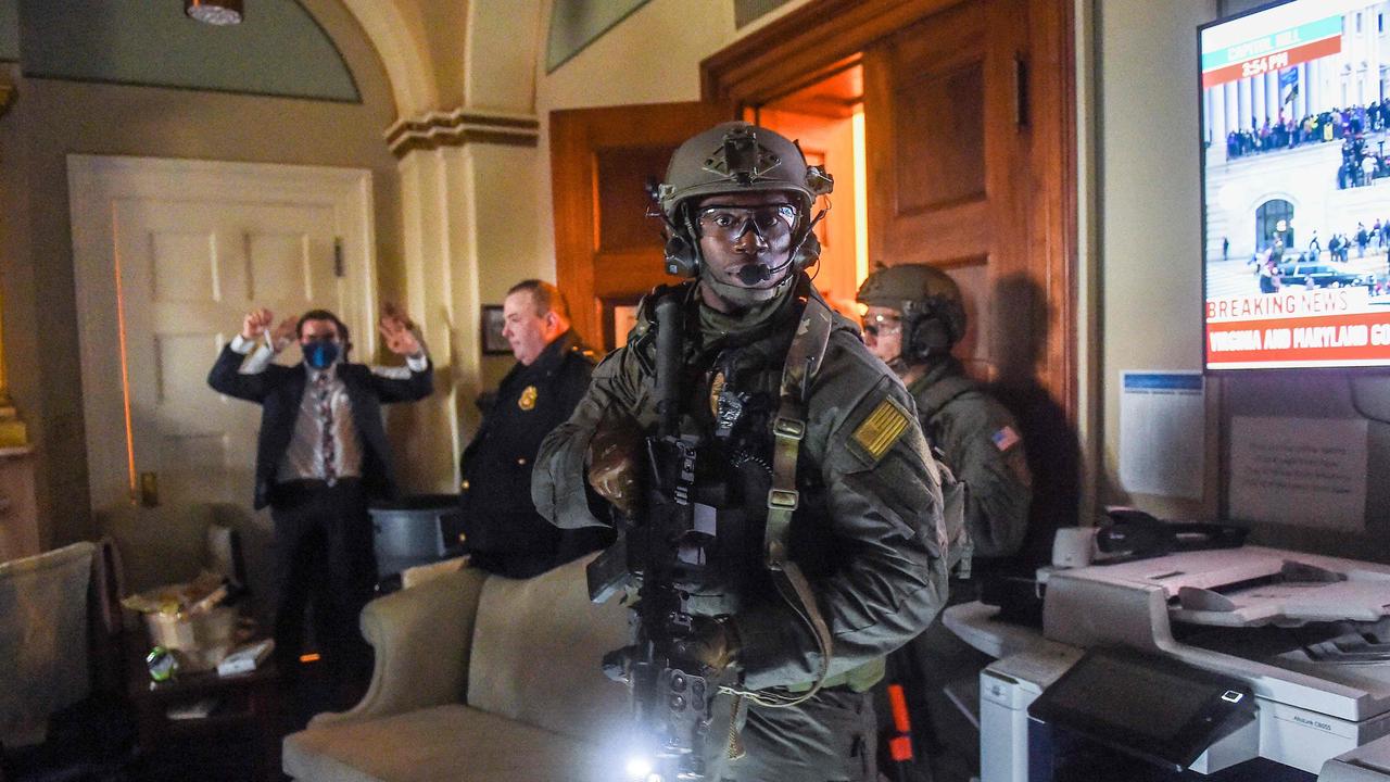 Capitol Police Swat team check everyone in the room as they secure the floor of Trump supporters in Washington, D.C. on January 6, 2021. Picture: Olivier Douliery/AFP
