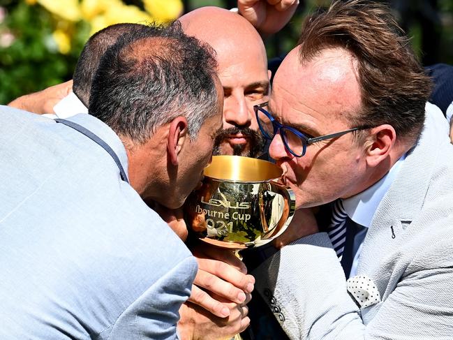 MELBOURNE, AUSTRALIA - NOVEMBER 02: Verry Elleegant owner Brae Sokolski kisses the Lexus Melbourne Cup after James Mcdonald rode #4 Verry Elleegant to victory in race 7, the Lexus Melbourne Cup during 2021 Melbourne Cup Day at Flemington Racecourse on November 02, 2021 in Melbourne, Australia. (Photo by Quinn Rooney/Getty Images)