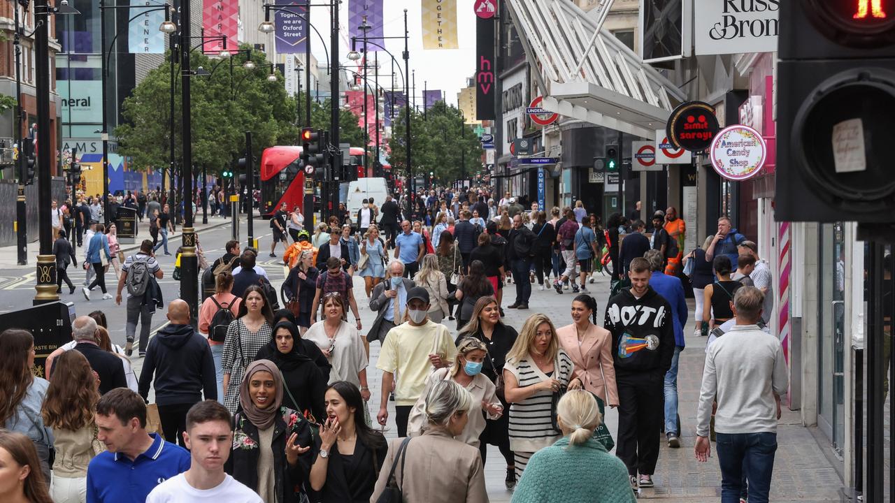 London’s Oxford Street shopping strip is heaving with few masks in sight. Photographer: Hollie Adam/Bloomberg via Getty Images