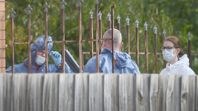 Forensics police outside the home. Picture: Tony Gough