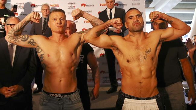 Danny Green and Anthony Mundine after yesterday’s weigh-in at Adelaide Oval. Picture: Sarah Reed