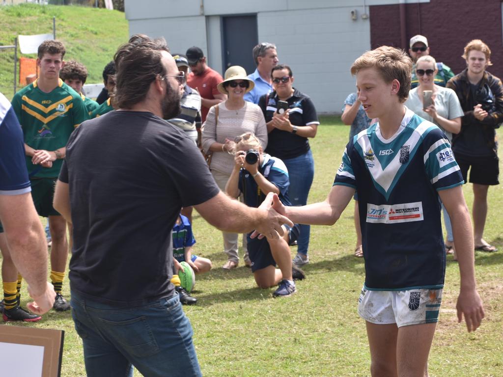 John Manning (left) gives Jaxon Purdue his premiership medal after the Mercy College v St Brendan's Cowboys Challenge grand final in Mackay, September 1, 2021. Picture: Matthew Forrest