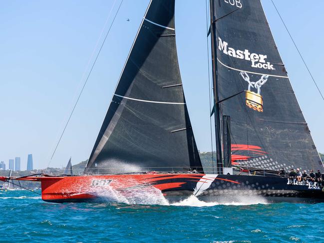 Master Lock Comanche passes between North and South Head at the start of the race. Picture: Justin Lloyd.