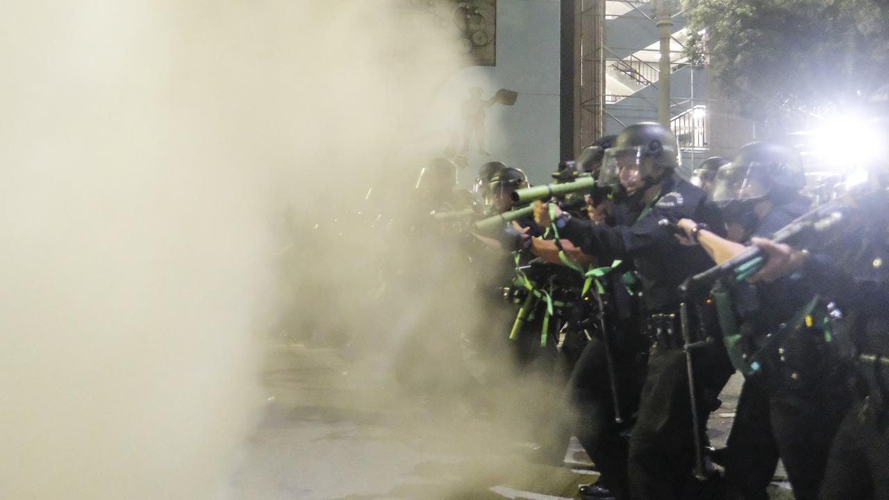 Police open fire shooting rubber bullets at demonstrators. Picture: Ringo H.W. Chiu