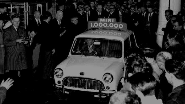 The one-millionth Mini is driven off the production line in its Birmingham factory by creator Alec Issigonis in 1965.