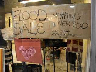 Open for business and sales notices  are a welcome sign for many in Lismore's CBD after the floods. Picture: Alison Paterson